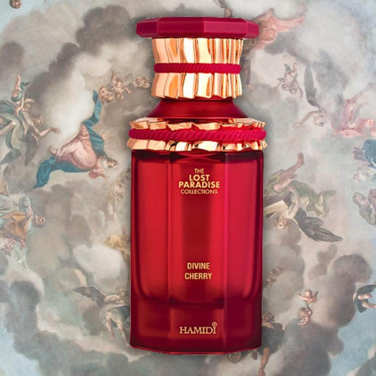 Hamidi Divine Cherry perfume bottle design with a red hue, featuring an elegant cap and intricate details.