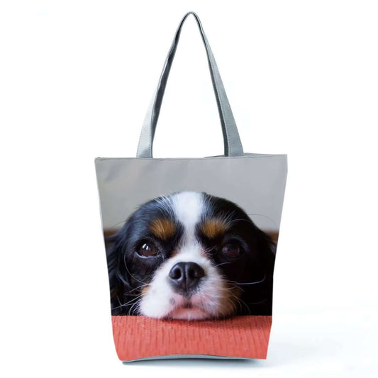 Cavalier King Charles Spaniel tote bag featuring a cute dog face design on a stylish bag.