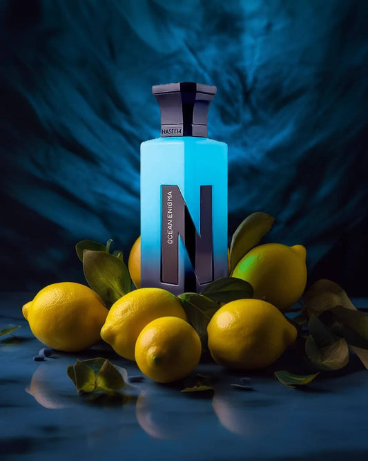 Naseem Ocean Enigma perfume bottle surrounded by fresh lemons on a colorful background.