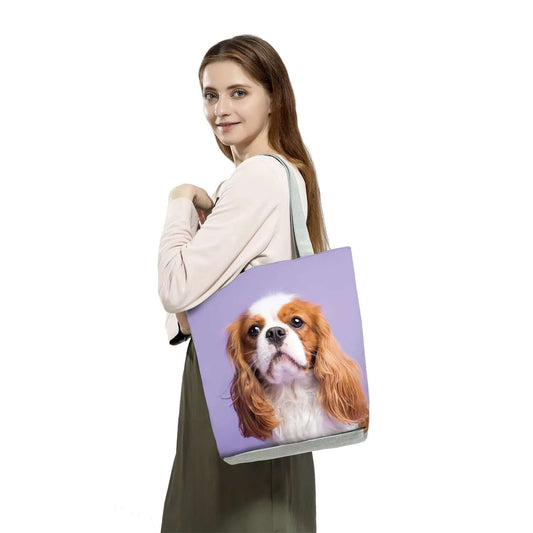 Woman holding a Puppy Dog Face Tote Bag featuring a cute dog design, perfect for casual outings and daily use.